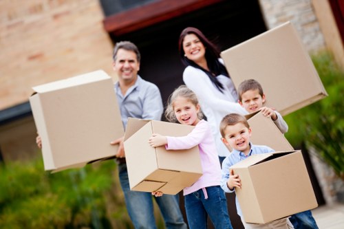 Professional movers handling furniture and boxes for a local move