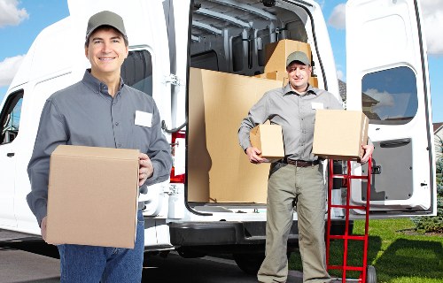 Loading furniture into a moving truck for a local relocation