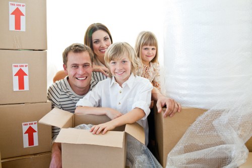 Packing and loading household furniture into a removals van for a local move