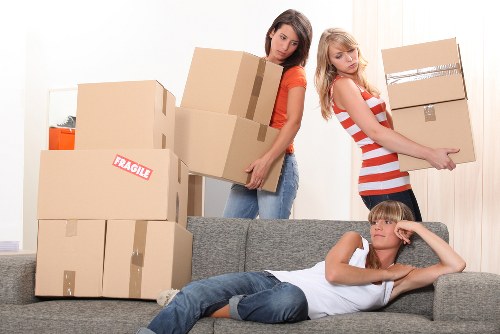 Local moving team unloading boxes and furniture at a Harrow on the Hill property
